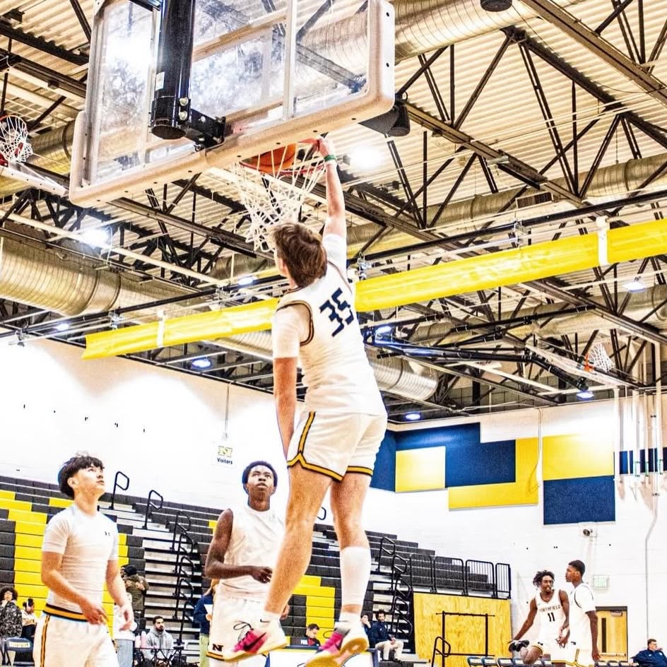 Cash Lacy finishing at the rim during basketball practice