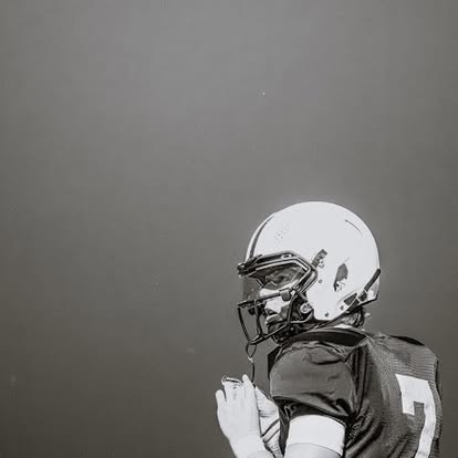 Cash Lacy wearing number 7 in football gear