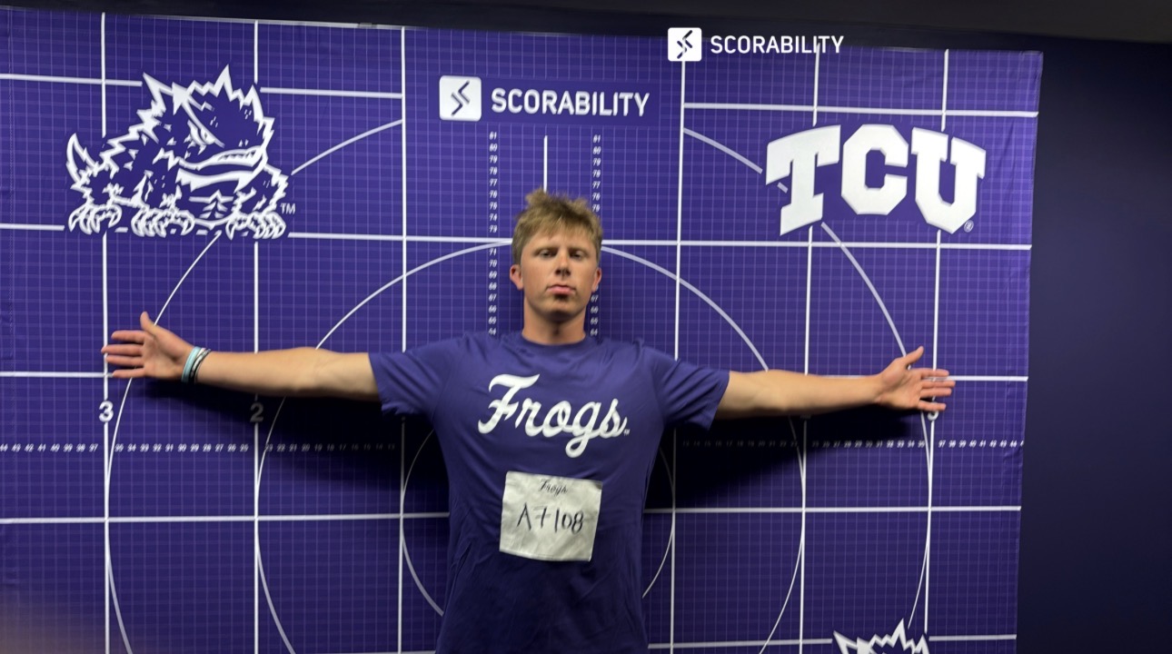 Cash Lacy at the purple TCU measurement backdrop, height 6 feet 2 inches